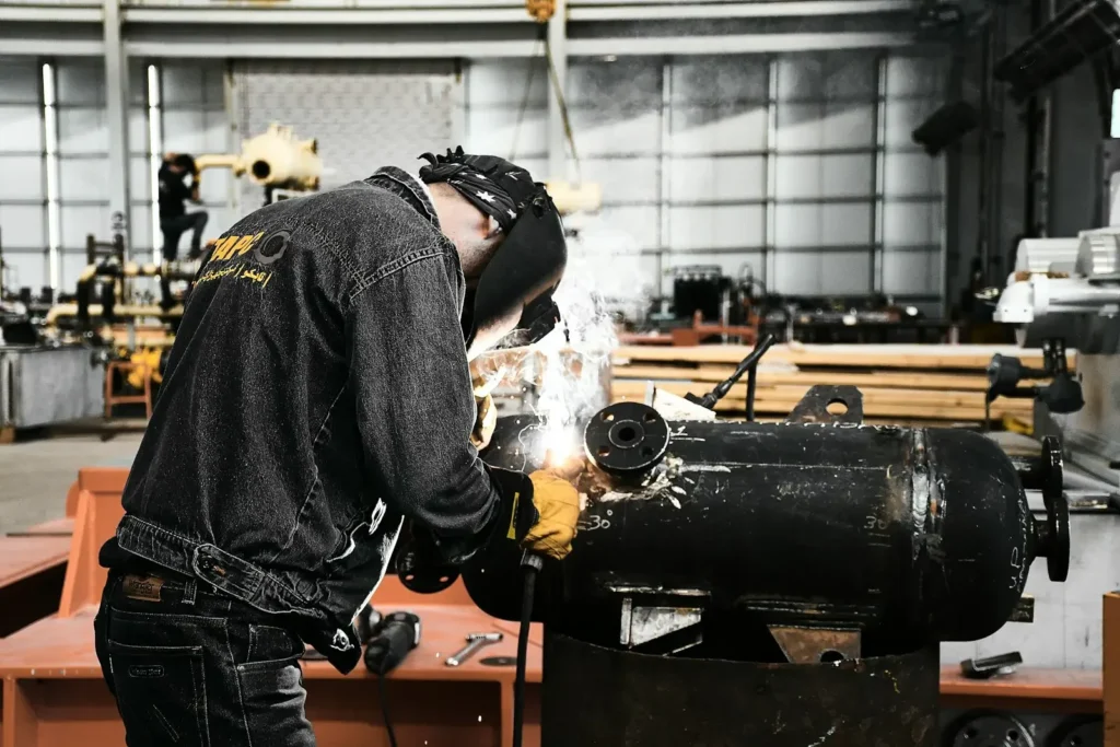 A man working on a machine in a factory